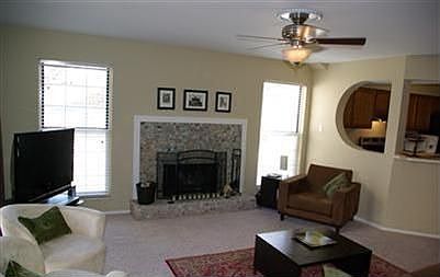 Natural light, neutral decor' & fireplace in family room