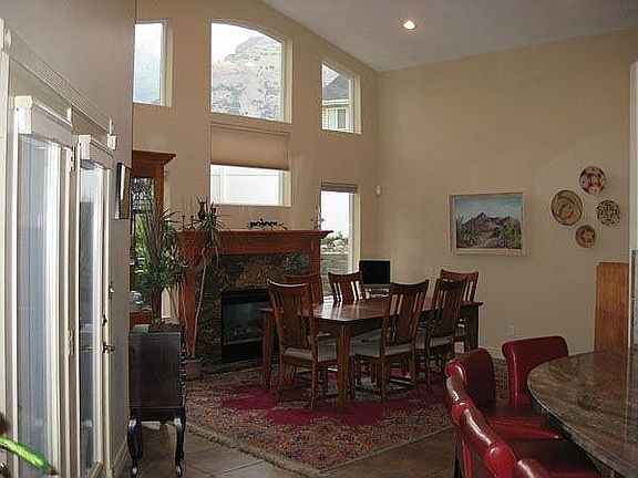 Dining room with mountain views from wall of windows