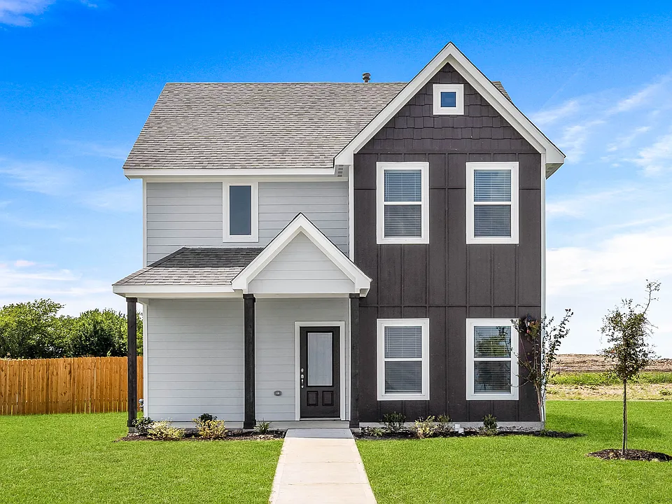 The Camellia is a beautiful two story home with an attached two-car garage and welcoming front porch.