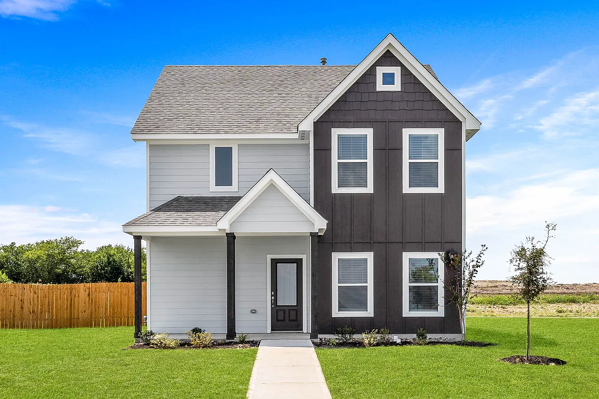 The Camellia is a beautiful two story home with an attached two-car garage and welcoming front porch. - Big Sky Estates