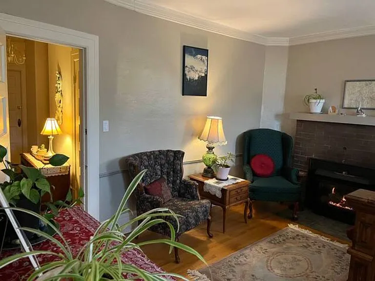 Lounge in these chairs by the gas fireplace!