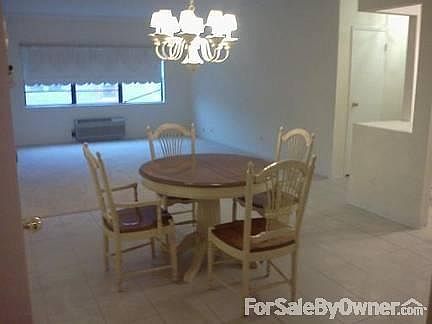 Dining room.
						:
						Dining room leading into living room, kitchen and hall to bedroom and bathroom.