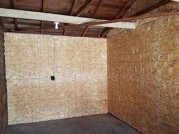 Roomy oversized single car garage with space for a workshop area