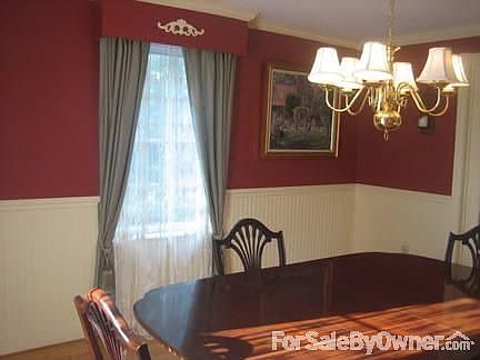 Formal dining room : Crown molding, wainscoting and built in valances with wood detail