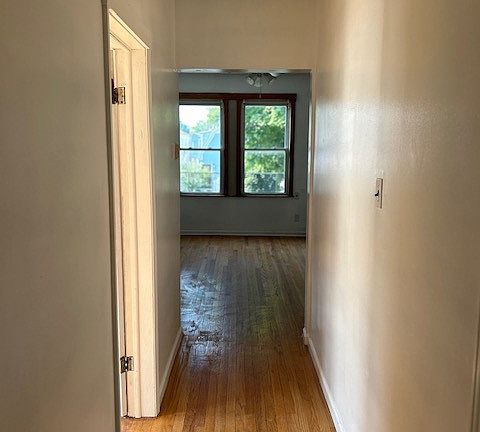 Hallway from Kitchen to Living Room space - bedrooms are off of this hallway.