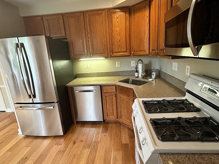 Stainless steel fridge, dishwasher and microwave are all 3 years or newer. Bosch dishwasher is extra quiet. Gas range is great for home chefs!