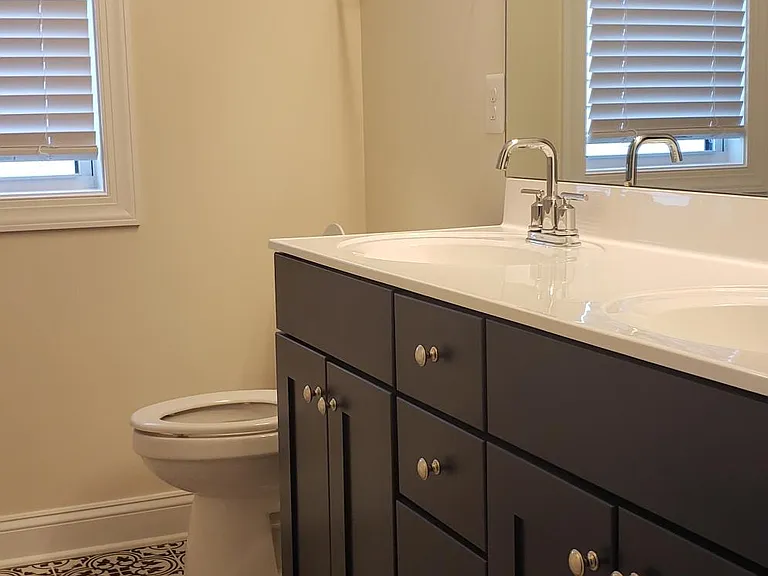 Actual picture of secondary hall bathroom. Upgraded tiles and cabinetry.