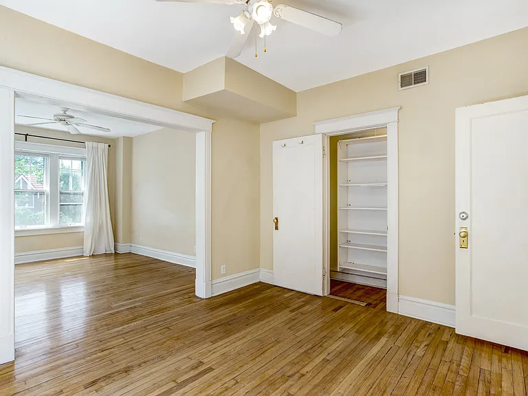 Primary Bedroom with closet view open