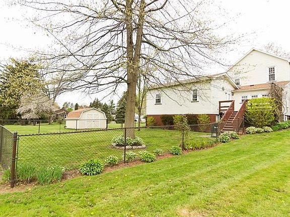 Back of home, fenced-in portion of yard