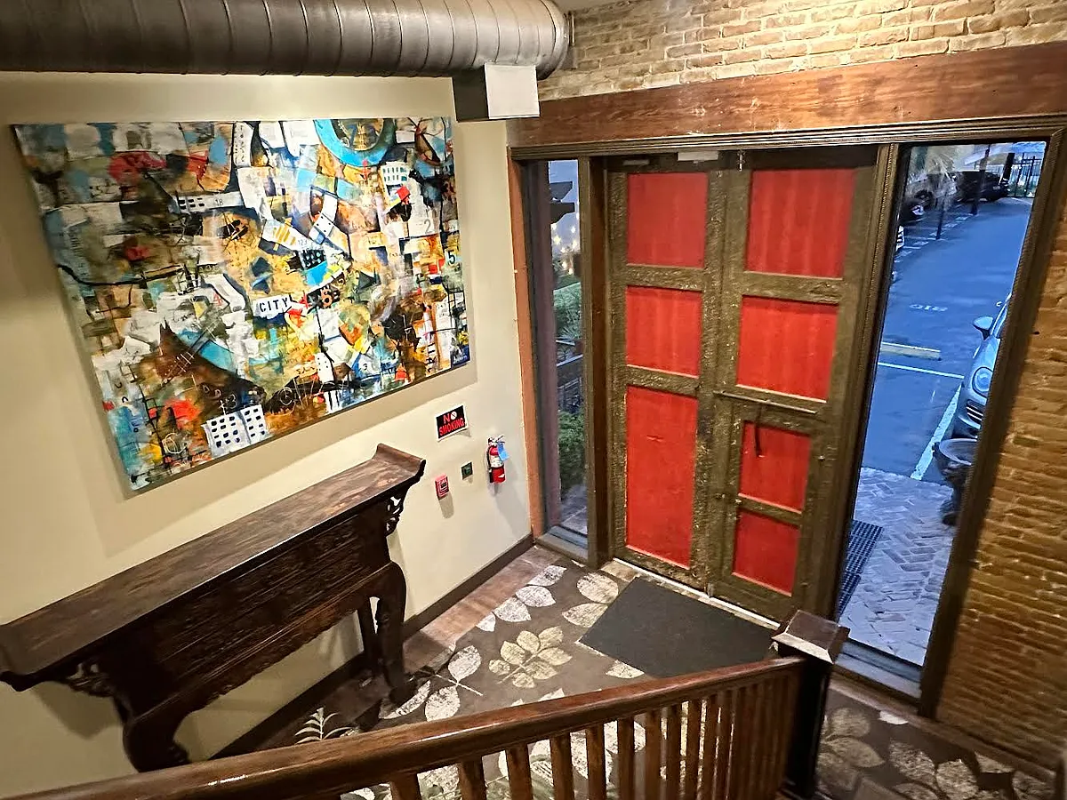 Building lobby private entrance from parking with beautiful art and decor - 321 S Flores St #106