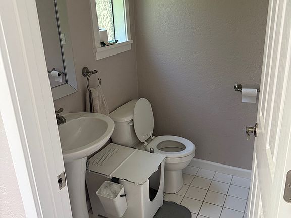 Half bath on main floor of the apartment (w/ living room, dining room, and kitchen).