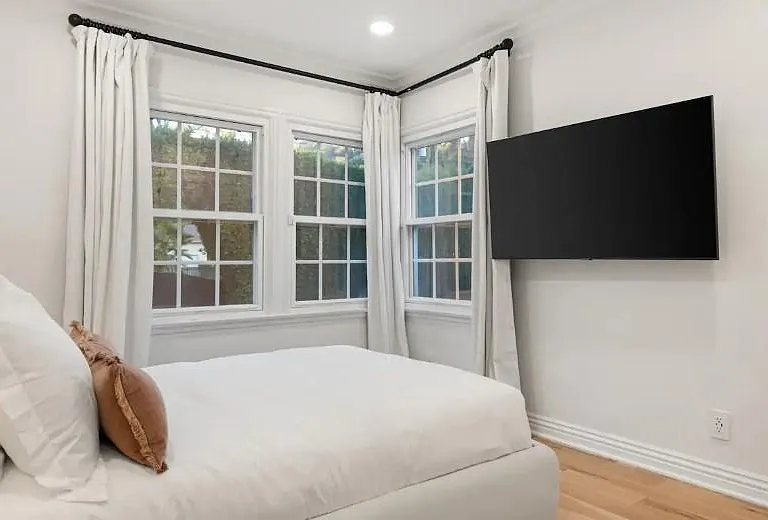 Elevate your experience with a Large Smart TV in Bedroom 2, providing modern entertainment for a delightful stay.