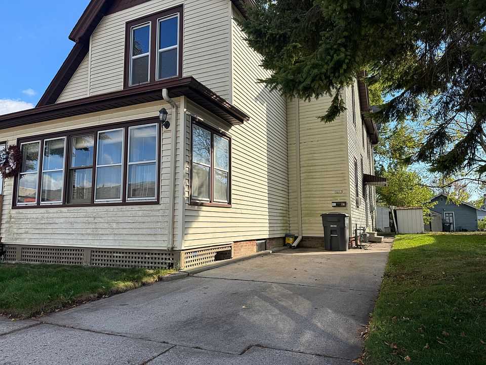 Driveway parking near side entrance.