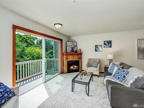 Cozy up to the fireplace and enjoy views off the back deck.