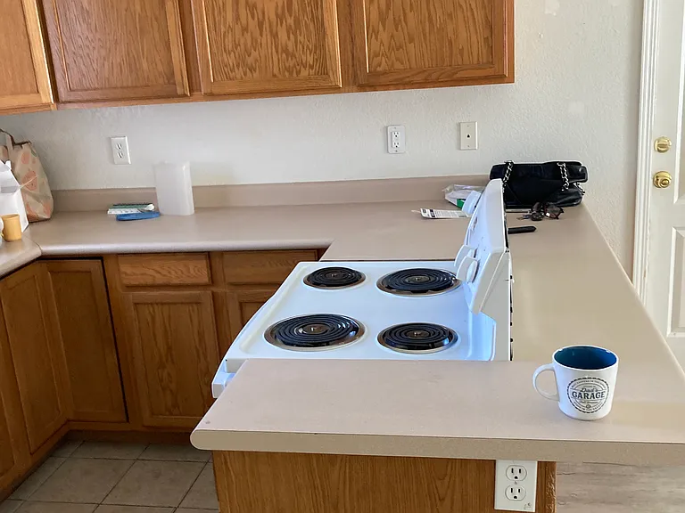 Kitchen area and electric stove.