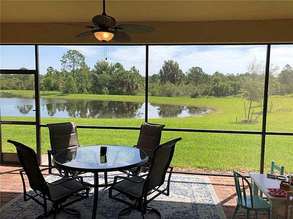 back yard lake view with preserve behind the lake