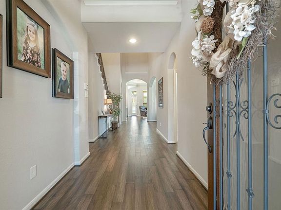 Grand two story entrance with lots of light and gorgeous wood floors!
