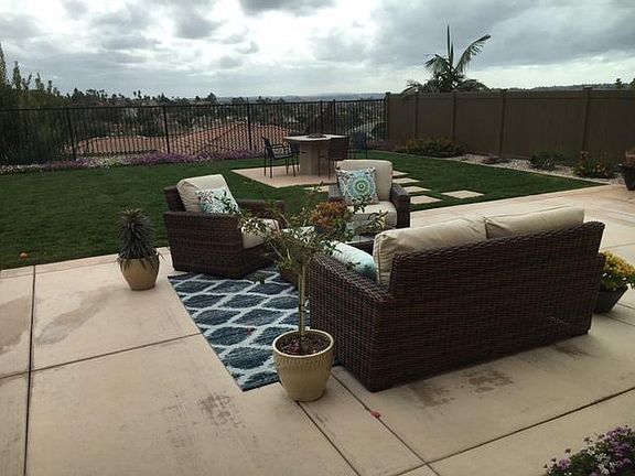 Awesome back yard with large patio, views, fire table