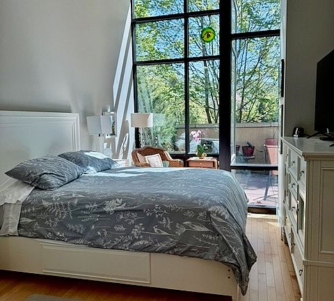 Stunning natural light in master bedroom.
