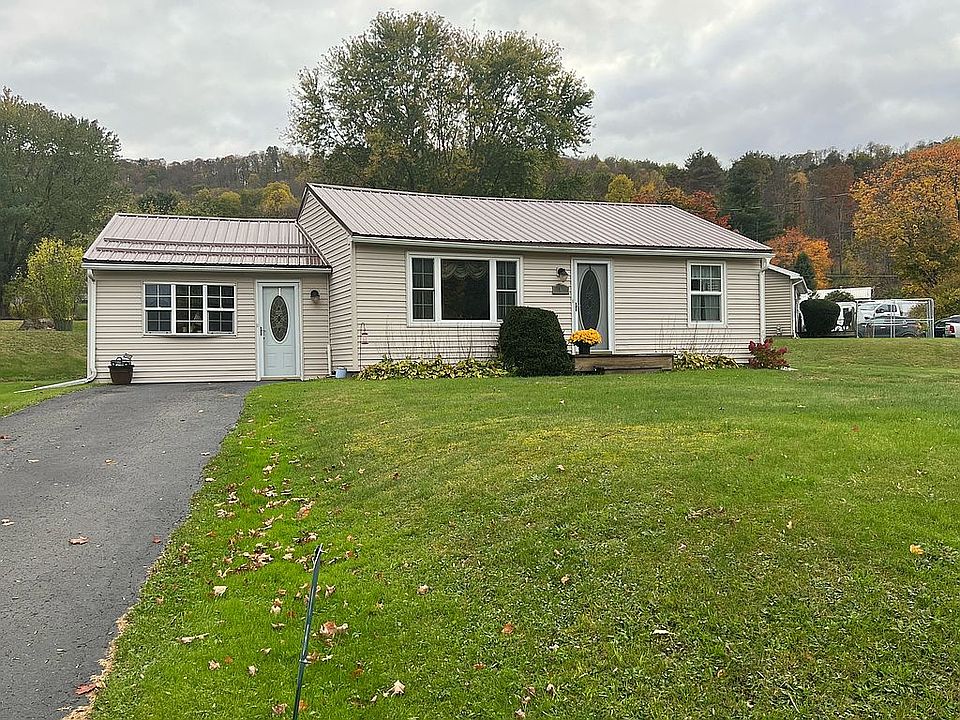 Corner lot with paved drive.