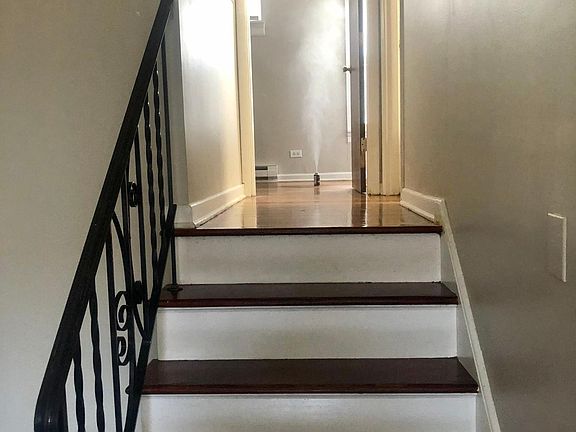 Beautiful Staircase to Living Space. Feels like a two-story unit.