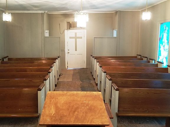 Pews, Light fixtures remain. Window AC included.