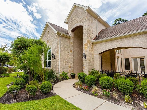 Beautiful mature landscaping and a front courtyard for entertaining.