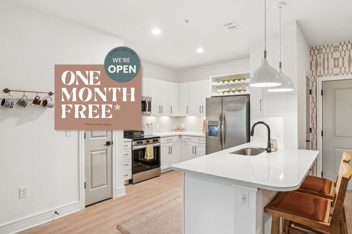 Kitchen with Quartz Countertop and Stainless Steel Appliances.