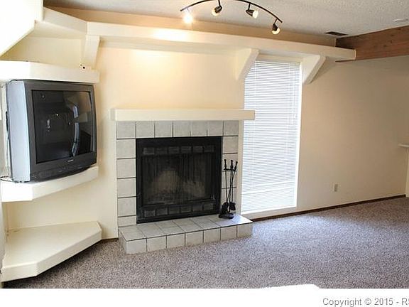 Living Room. Built-in's, Wood-burning Fireplace, New Paint and Carpet!