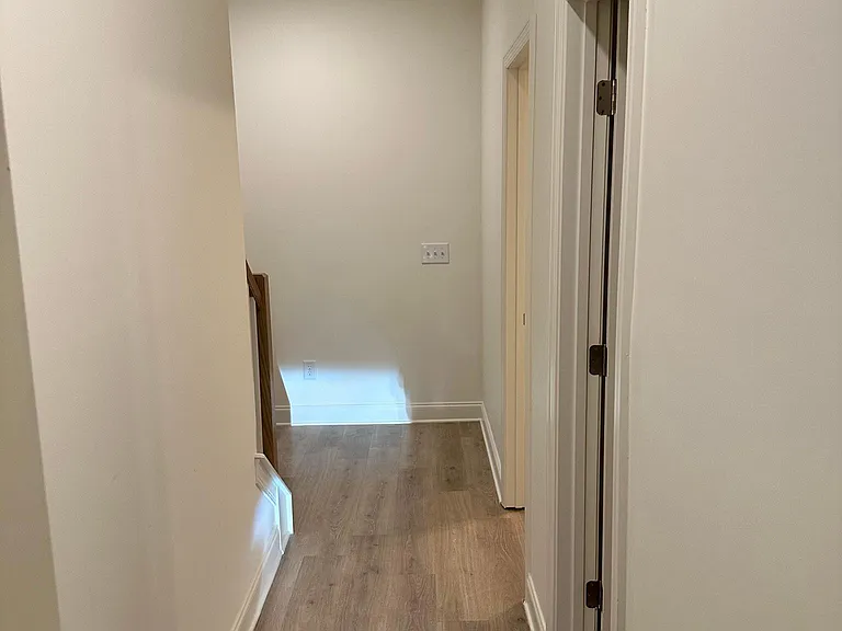 Hallway from Garage to 1st bedroom and stairs to Main floor