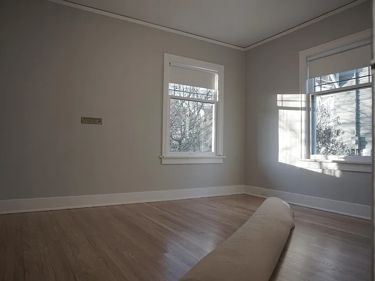 main floor bedroom-both functioning double hung windows with storm windows