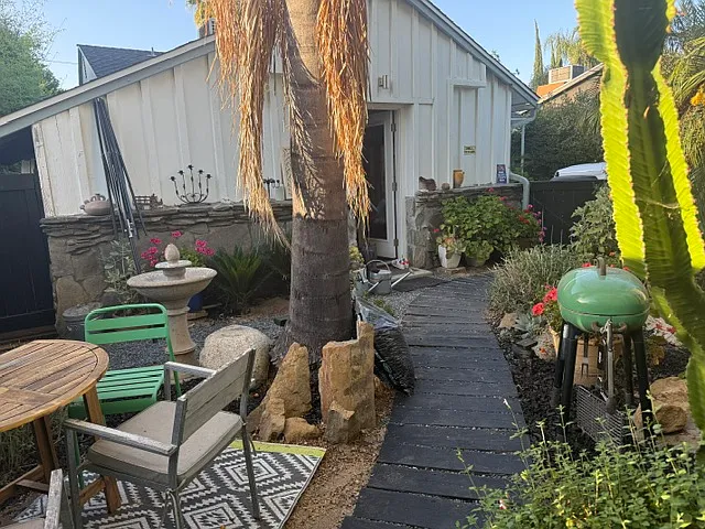Front yard, secluded and secure w/ private entrance from street. Charcoal BBQ. Door to studio