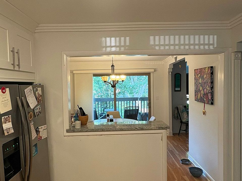 Flexible living area extends into a high top bar area and dining room.