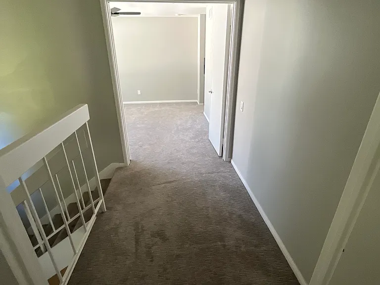 Upstairs hallway between the two bedrooms.