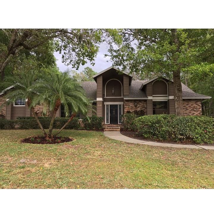 Large lot with lots of trees, fenced with large backyard behind pool enclosure