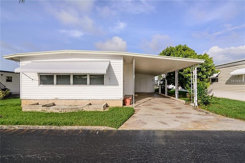 Spacious 2 bedroom/2 bath double wide home with laundry facility in carport attached shed. 1208 sq ft. Newer vinyl siding and mo