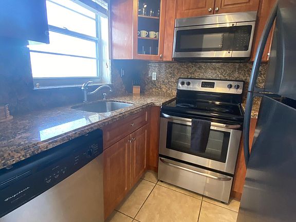 Alley Kitchen with Stainless Steel Appliances