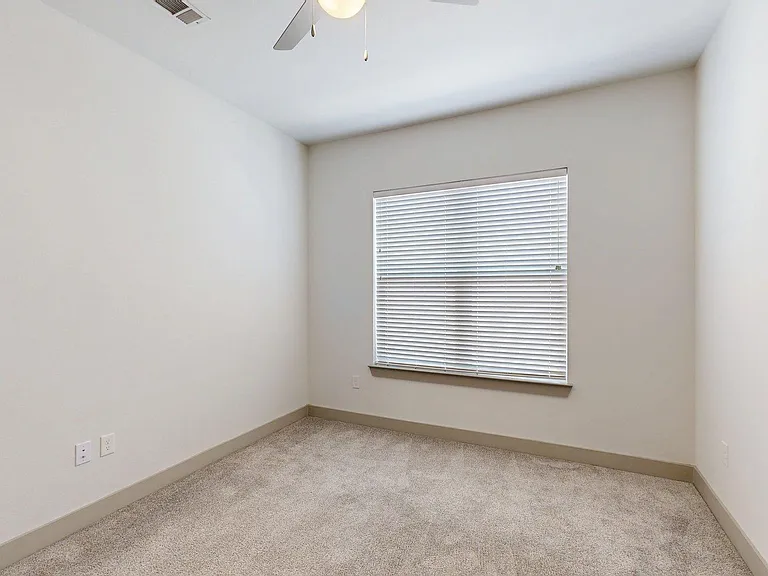 Spacious apartment Bedroom with Carpet Floor.