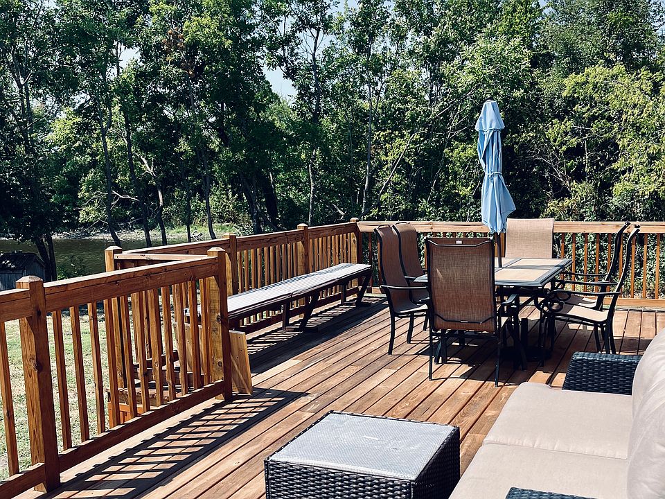 The homes large deck overlooking the lake