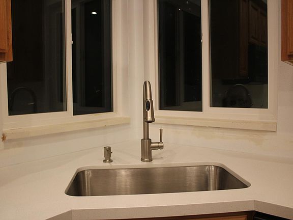 Kitchen windows looking into back yard.