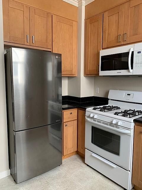 LG fridge and gas stove with microwave.