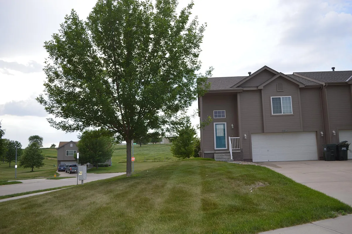 Front yard. Lawn care included with no additional cost!! - 18848 Jacobs Cir