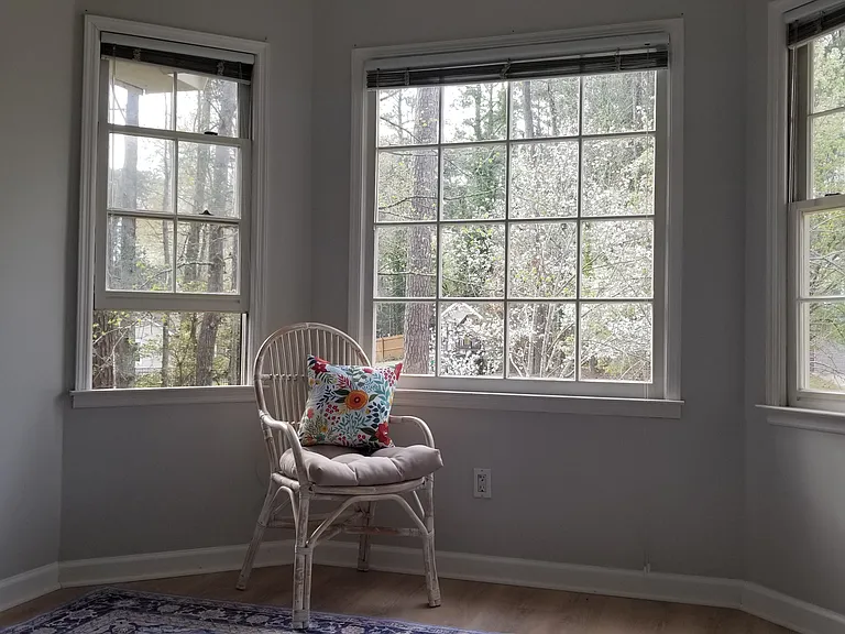 Sit and enjoy the light engulfing you in 
the bay window area