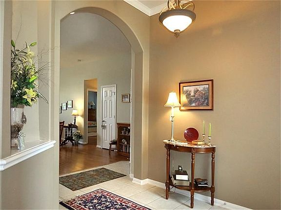 Wide foyer with art niche greets guests!