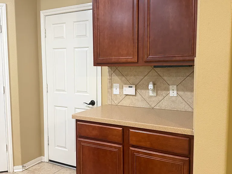 Door in kitchen to attached garage