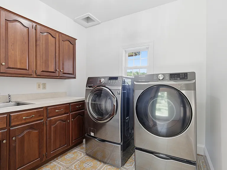 Main level laundry room with chute.
