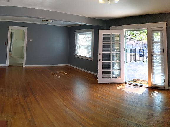 Living and dining room without furniture.