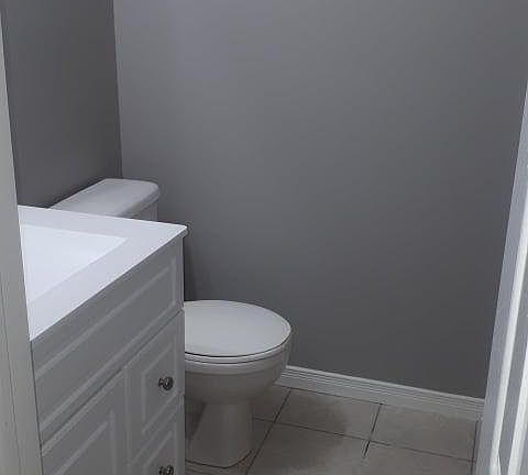 Main floor powder room off kitchen.