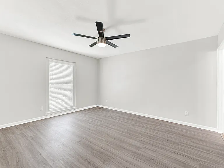 Spacious primary bedroom is separate from other bedrooms.