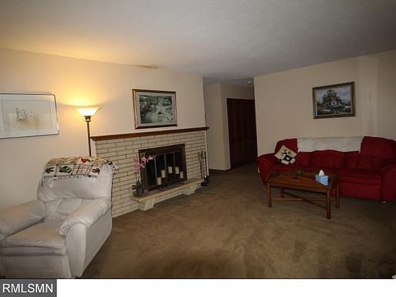 Generous living room space is found on the main level with the wood burning fireplace.